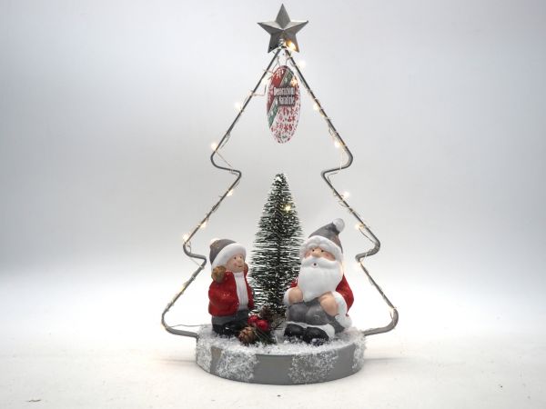 Albero di Natale in metallo con base in tronco innevato con luce calda e personaggi